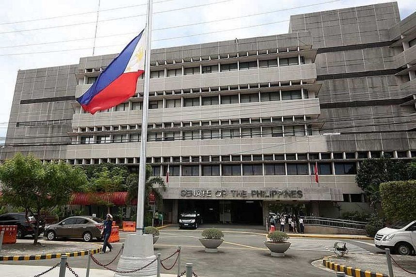 The Philippine flag flying in front the Senate building